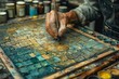 © Tatyana - Painter is working in his studio. Close-up of the hand of a elderly master restorer.