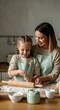 © Margareta - Mother and Daughter Enjoying Baking Together in Homely Kitchen