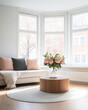 © JuanM - Cozy living room with vase of flowers, large windows, and modern decor in soft afternoon light