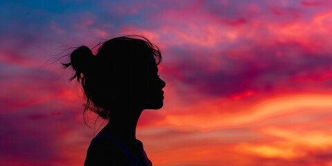 Canvas Print - Bold silhouette of a girl against a colorful dusk backdrop.