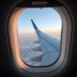 © Sabina Rasulova - View of an airplane wing in the sky from a window. Flight on an airplane, view from the airplane window.