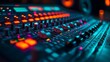 © Angelo - A close-up of a soundboard, audio mixer with colorful lights. recording studio shot. Symbolizes audio engineering, sound and music recording.