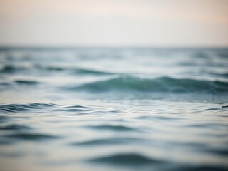 Soft ocean waves at dusk with a serene horizon

