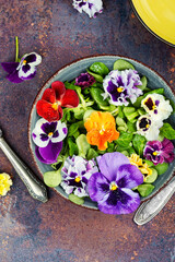 Wall Mural - Colorful edible flower salad.