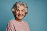 senior woman smiling on blue background white hair cheerful fine eldery healthy