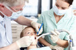 © peopleimages.com - Dentist, people and boy with mirror of consultation, teeth whitening and oral inspection of dental hygiene. Orthodontics, child and tools of cleaning procedure, cavity assessment and braces treatment