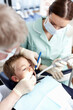 © peopleimages.com - Dentist, woman and boy with mirror of consultation, teeth whitening and oral inspection of dental hygiene. Orthodontics, child and tools of cleaning procedure, cavity assessment and braces treatment