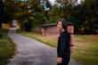 © Иванна Емельянова - Woman with yoga mat enjoying a peaceful walk outdoors