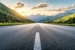 © kribbox - A straight asphalt road leading into the distance between mountains and hills with a bright sky, clouds and a setting sun.