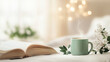 © Chatupat - cozy indoor setting with steaming cup of tea and open book creates peaceful atmosphere. Soft lighting and delicate flowers add to serene ambiance.