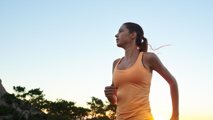 Girl, sky and space in forest for running for fitness in nature for exercise, training and workout. Woman, thinking and athlete runner in outdoor sports for mockup for sunrise and health in woods