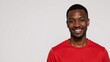 © Pixel Matrix - An African American man wearing a red T-Shirt is presented against a clean white backdrop in an isolated image