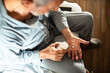 © Davor - Elderly man taking medication in the morning at home