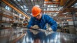© utaem2022 - Metalworker marking lines on sheet metal in factory