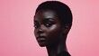 © Marco - portrait of a black woman with little hair on pink background