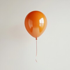 Wall Mural - a single orange balloon floating mid-air, its glossy surface reflecting soft light, set against a si
