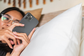 Person Using Smart phone in Bed