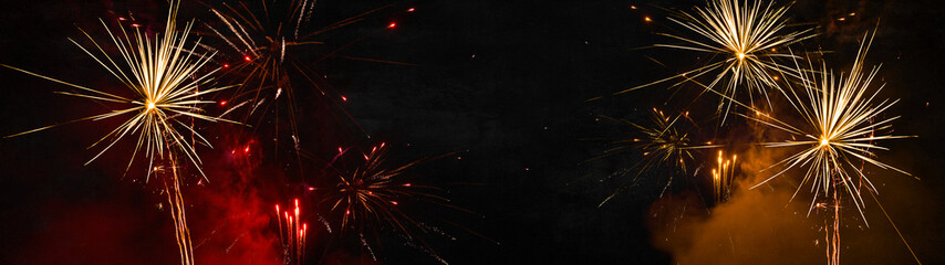 Fireworks sylvester 2025, silvester, happy new Year, New Year's Eve festival background banner panorama long wide - Colorful red firework pyrotechnics on dark black night sky