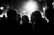 © Michael - Black Silhouette of a group of friends chatting and laughing on a street corner at night on a white background.