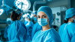 © Valeri - young female surgeon, in the background a team of doctors performing an operation