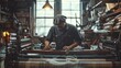© Yuliia - A man expertly works at a loom, crafting intricate fabric in a bright, organized workshop