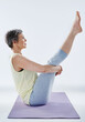 © peopleimages.com - Stretching, yoga and fitness for mature woman, serious and wellness with routine, healthy and warm up. Gym, flexible and activity for pilates, workout and exercise for person, morning and confident