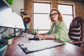 Photo of sweet charming lady assistant wear shirt eyeglasses writing messages modern device indoors workplace workstation