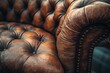 © Rufino - A brown leather couch with a brown leather cushion