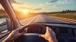 © liliyabatyrova - A person is driving a car on a highway with the sun setting in the background