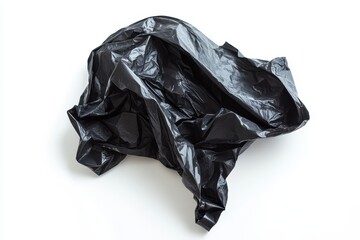 A crumpled black plastic bag isolated on a white background.