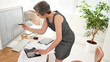 © peopleimages.com - Mature woman, architect and computer screen in office, creative and review for floor plan, property or renovation. Person, ux and blueprint with design, drawing or development for real estate project