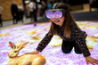 © Konstiantyn Zapylaie - Child exploring virtual reality with interactive animal projection