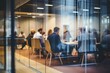 © melhak - A group of people sitting at a table in a conference room - People
