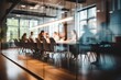 © melhak - A group of people sitting at a table in a conference room - People