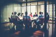 © melhak - A group of people sitting at a table in a conference room - People
