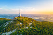 © pyty - This aerial view captures Jested mountain in Liberec, Czechia, showcasing the iconic hotel and TV transmitter amid sprawling greenery at sunset, revealing stunning landscapes.