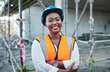 © peopleimages.com - Construction site, architecture and black woman in portrait with arms crossed, maintenance or inspection. Engineering, business person or happy manager with helmet for safety, development or building
