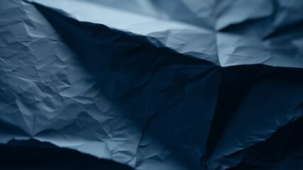 Fototapete - A delicate close-up of dark fabric reveals intricate textures and subtle wrinkles, showcasing how light interacts with the material in an indoor space.