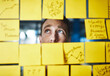 © peopleimages.com - Business, man and confused with sticky notes at work for problem solving and overwhelmed by tasks. Professional, employee and uncertain for company statistics, budget increase and frown for inflation