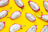 Ripe dragonfruit or pitahaya on yellow background.