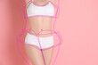 © New Africa - Woman in underwear posing on pink background, closeup. Lines repeating her slim body