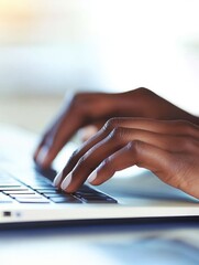 Canvas Print - Close-up of hands typing on a laptop keyboard.