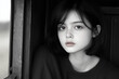 © Hew Pallot - black and white portrait of young girl with thoughtful expression by window