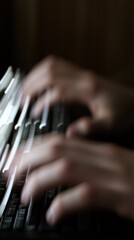 Sticker - Close up of a person's hands typing on a keyboard, with a blurred background.