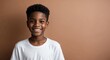 © Arceli - african teen boy brown background wearing plain white tshirt smiling happy portrait