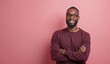 © Yury - Cheerful African American Man Smiling Confidently Against Pink Background with Copy Space
