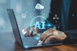 © Suriyo - Businessman leveraging AI technology to monitor data privacy compliance, automating processes to meet regulatory standards effectively.