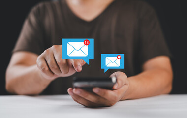 Fototapete - Business email communication in the digital age new messages and alerts. Inbox with email Marketing Strategy and Notifications. internet technology. businessman using smartphone with email.