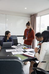 Wall Mural - group of software engineers design ux/ui for applications on smartphone/laptop