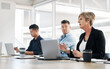 © peopleimages.com - Meeting, woman or business people on laptop with feedback, discussion or teamwork. Corporate review, financial or professional colleagues talking for collaboration, advice and planning for growth